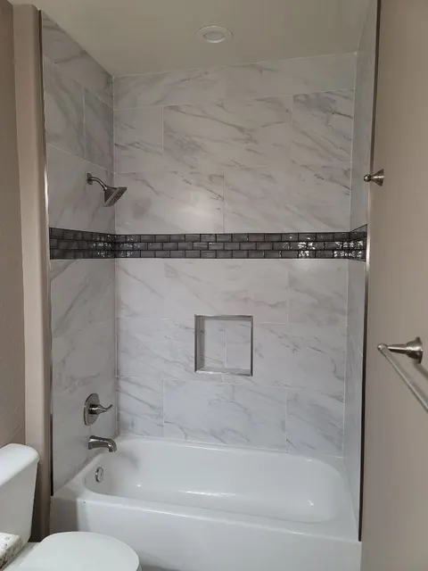 Bathtub remodel and tile installation by CR Construction Remodeling